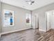 Cozy bedroom with natural light from windows and hardwood floors at 1021 E Edgerton St, Dunn, NC 28334