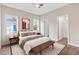 Comfortable bedroom featuring a bed with pillows and a bench, along with plenty of natural light at 1021 E Edgerton St, Dunn, NC 28334