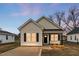Charming, newly built one-story home featuring a covered porch and freshly poured concrete driveway at 1021 E Edgerton St, Dunn, NC 28334