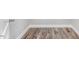 Hallway corner features wood-look floors, white trim, and neutral paint at 1021 E Edgerton St, Dunn, NC 28334