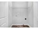 A modest laundry room with a shelf and a hookup for a washer and dryer at 1021 E Edgerton St, Dunn, NC 28334