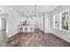 Open-concept living area featuring a breakfast bar with seating and plenty of natural light at 1021 E Edgerton St, Dunn, NC 28334