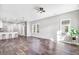 Spacious living area featuring hardwood floors, a ceiling fan, and large windows offering ample sunlight at 1021 E Edgerton St, Dunn, NC 28334
