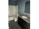 Bathroom features a granite vanity, shower-tub combo, tile floor, and modern toilet at 104 Ginger Cir, Selma, NC 27576