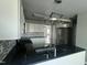 Modern kitchen with white cabinets, stainless steel refrigerator, and granite counters at 104 Ginger Cir, Selma, NC 27576
