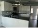 Modern kitchen featuring white cabinets, stainless steel appliances, and granite countertops at 104 Ginger Cir, Selma, NC 27576