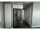 Modern kitchen featuring a stainless steel refrigerator and adjacent pantry at 104 Ginger Cir, Selma, NC 27576