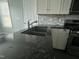 Granite countertops accent this kitchen with stainless steel appliances, sink, and white cabinets at 104 Ginger Cir, Selma, NC 27576