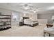 Spacious bedroom with a seating area, shelf, large bed, and recessed lighting at 105 Sunstone Dr, Cary, NC 27519