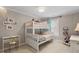Bright and colorful bedroom with bunk beds, desk, and window at 105 Sunstone Dr, Cary, NC 27519