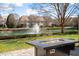 Scenic backyard with a view of the lake and fountain, plus an outdoor fire pit at 105 Sunstone Dr, Cary, NC 27519