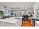 Open-concept kitchen with island, seamlessly connecting to the dining and living areas at 105 Sunstone Dr, Cary, NC 27519