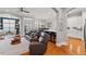 Open concept living room and kitchen with wood floors and lots of natural light at 105 Sunstone Dr, Cary, NC 27519