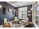 Cozy sitting area with navy walls, white trim, and multiple windows for natural light at 105 Sunstone Dr, Cary, NC 27519
