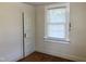 Bedroom featuring a door and window at 1111 Spring Valley Lake Rd, Henderson, NC 27537