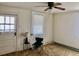 Bedroom featuring a ceiling fan, window, and door to the outside at 1111 Spring Valley Lake Rd, Henderson, NC 27537