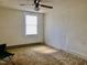 Bedroom featuring a window, ceiling fan, and hardwood floors at 1111 Spring Valley Lake Rd, Henderson, NC 27537
