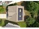 Aerial view of a house featuring a roof with solar panels surrounded by trees at 1112 Jewel Creek Dr, Cary, NC 27519
