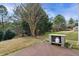 Spacious backyard with a concrete patio and outdoor kitchen at 1112 Jewel Creek Dr, Cary, NC 27519