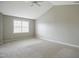 Spacious bedroom featuring neutral walls, carpet, ceiling fan and a window at 1112 Jewel Creek Dr, Cary, NC 27519