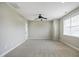 Spacious bonus room with carpet, a fan, neutral walls, and a window with blinds at 1112 Jewel Creek Dr, Cary, NC 27519