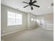 Spacious bonus room with carpet, a fan, neutral walls, and windows with blinds at 1112 Jewel Creek Dr, Cary, NC 27519