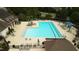 Aerial view of a community pool with ample seating and manicured landscaping at 1112 Jewel Creek Dr, Cary, NC 27519