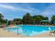 Enjoy the community pool with shaded pergola areas, lounge seating, and pristine blue water at 1112 Jewel Creek Dr, Cary, NC 27519