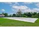 Community volleyball court featuring manicured grass and blue skies at 1112 Jewel Creek Dr, Cary, NC 27519