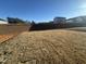 Backyard with newly laid sod and a retaining wall at 11186 Salers Loop, Middlesex, NC 27557
