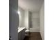 Clean bathroom featuring shower-tub combo, vinyl floors and white vanity at 11186 Salers Loop, Middlesex, NC 27557
