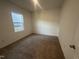 Bedroom with neutral carpet, white walls and natural light at 11186 Salers Loop, Middlesex, NC 27557