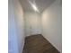 Bright entryway with light wood floors, white walls, and a neutral-colored front door at 11186 Salers Loop, Middlesex, NC 27557