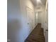 Hallway features wood-look floors, neutral-colored walls, and recessed lighting fixtures at 11186 Salers Loop, Middlesex, NC 27557