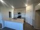 Modern kitchen featuring stainless appliances, white countertops, and ample cabinet space at 11186 Salers Loop, Middlesex, NC 27557