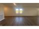 Spacious living room featuring wood-look flooring, recessed lighting and natural light at 11186 Salers Loop, Middlesex, NC 27557