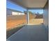 Covered patio overlooks backyard with retaining wall at 11186 Salers Loop, Middlesex, NC 27557