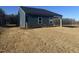 View of home's rear exterior and newly laid sod at 11186 Salers Loop, Middlesex, NC 27557
