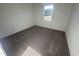 Cozy bedroom with neutral carpet and a window offering ample natural light at 11844 Ayshire Dr, Middlesex, NC 27557