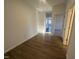 Bright entryway featuring wood-look floors leading to the kitchen and bedrooms at 11844 Ayshire Dr, Middlesex, NC 27557
