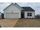 Charming single-Gathering home with a garage and freshly installed sod in the front yard at 11844 Ayshire Dr, Middlesex, NC 27557