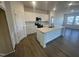 Modern kitchen featuring an island and stainless steel appliances, and white cabinetry at 11844 Ayshire Dr, Middlesex, NC 27557