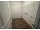 Efficient laundry room with vinyl floors, shelving, and washer/dryer connections at 11844 Ayshire Dr, Middlesex, NC 27557