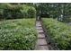 Charming backyard landscaping with stone steps at 122 Banyon Tree Ln, Cary, NC 27513