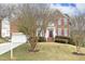 Charming brick two-story home with attached garage and well-maintained lawn at 122 Banyon Tree Ln, Cary, NC 27513