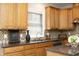 Close-up view of a kitchen with stainless steel appliances and wooden cabinetry at 122 Banyon Tree Ln, Cary, NC 27513
