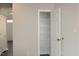Open door to pantry closet featuring white-wire shelving and natural lighting at 122 Banyon Tree Ln, Cary, NC 27513