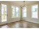 Bright dining area with modern lighting and access to a deck at 1225 Barreto Drive Dr, Wendell, NC 27591