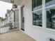 Covered front porch showcasing sleek, modern lines and large windows offering natural light at 1225 Barreto Drive Dr, Wendell, NC 27591