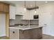 Kitchen island featuring granite countertops, pendant lights, and custom cabinets at 1225 Barreto Drive Dr, Wendell, NC 27591